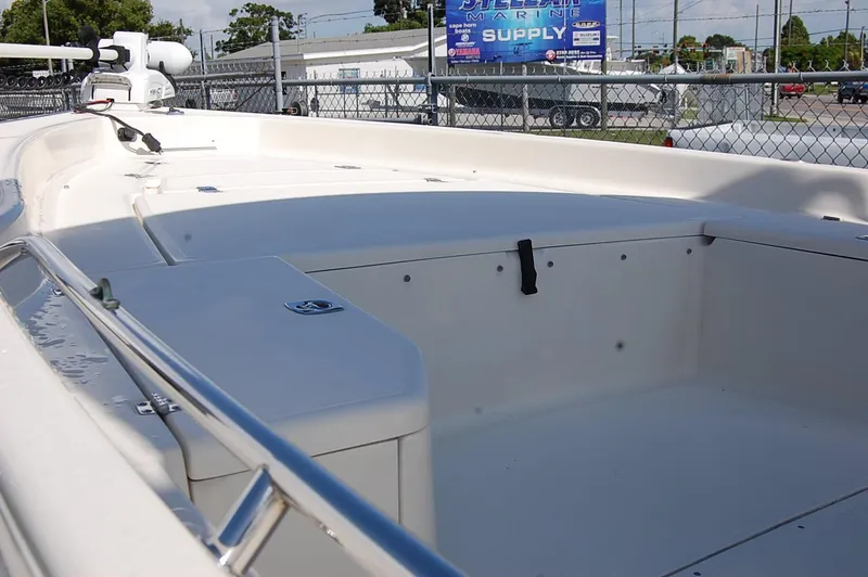 Slide: The Image of 2006 Scout 240 boat interior with spacious deck and storage compartments. - 4