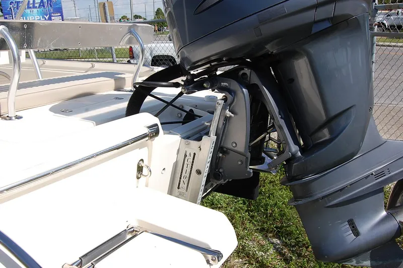 Slide: The Image of 2006 Scout 240 boat with outboard motor and seating area. - 6