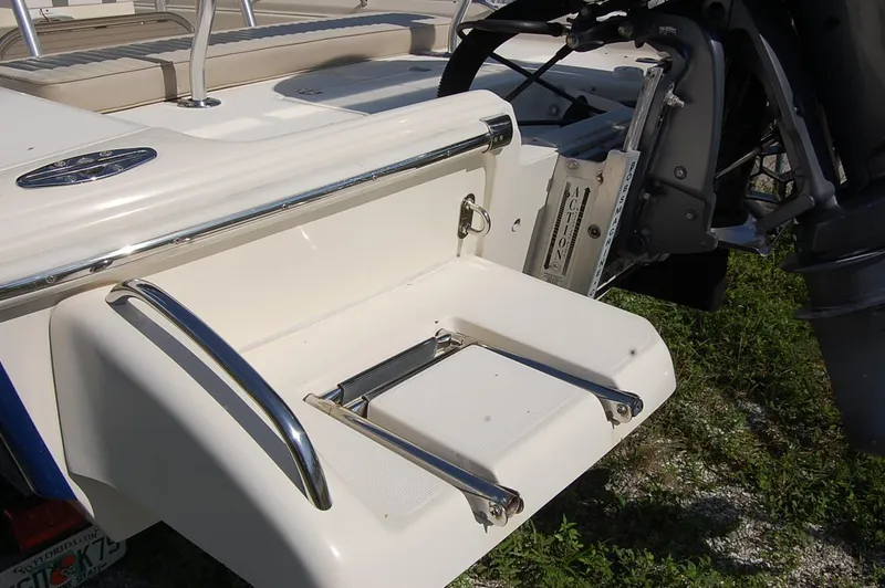 Slide: The Image of Rear view of a 2006 Scout 240 boat with a swim platform and ladder. - 7