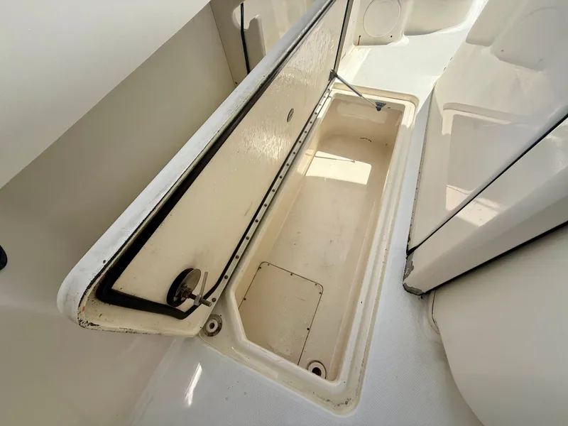 Slide: The Image of Open storage compartment on 2014 World Cat 295 CC boat. - 27