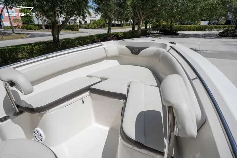 Slide: The Image of 2023 Sailfish 220 CC boat interior with cushioned seating and sleek design. - 8