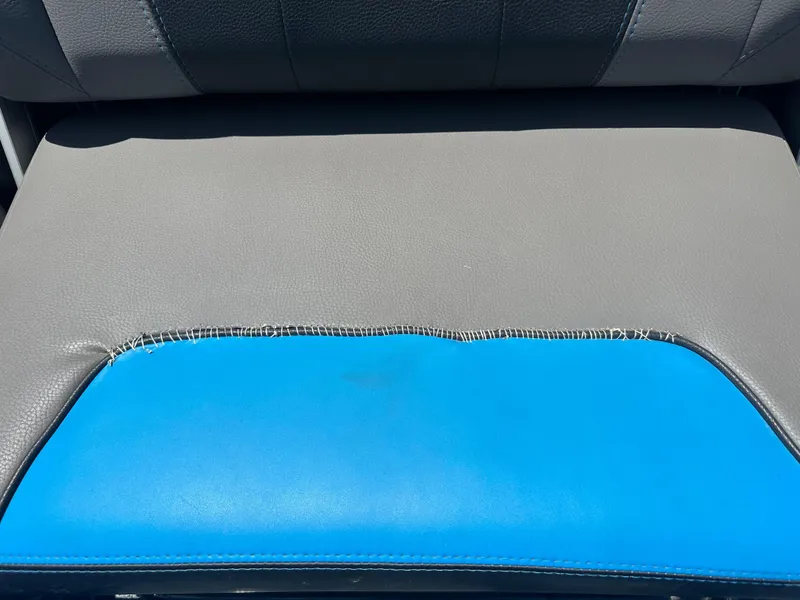 Slide: The Image of Gray and blue seat upholstery detail of 2020 Malibu Wakesetter 25 LSV boat. - 15