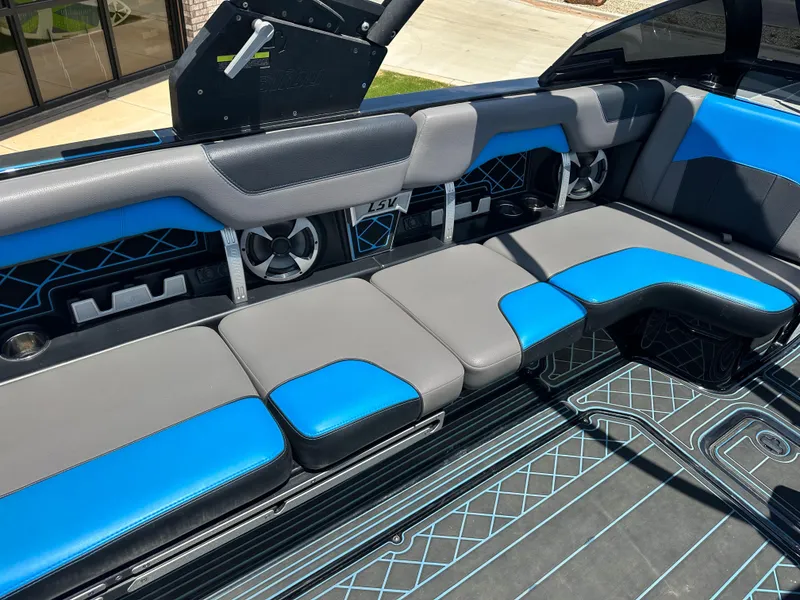 Slide: The Image of 2020 Malibu Wakesetter 25 LSV interior with blue and gray seating, modern design. - 17