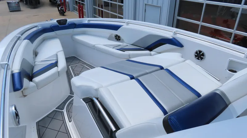 Slide: The Image of 2016 Sunsation 34 CCX boat interior with blue and white seating, modern design. - 17