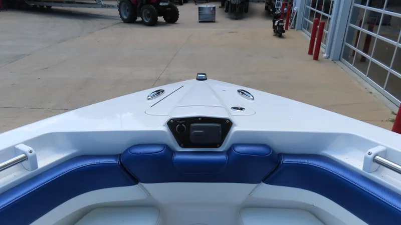 Slide: The Image of 2016 Sunsation 34 CCX boat interior with blue seating and white deck. - 18