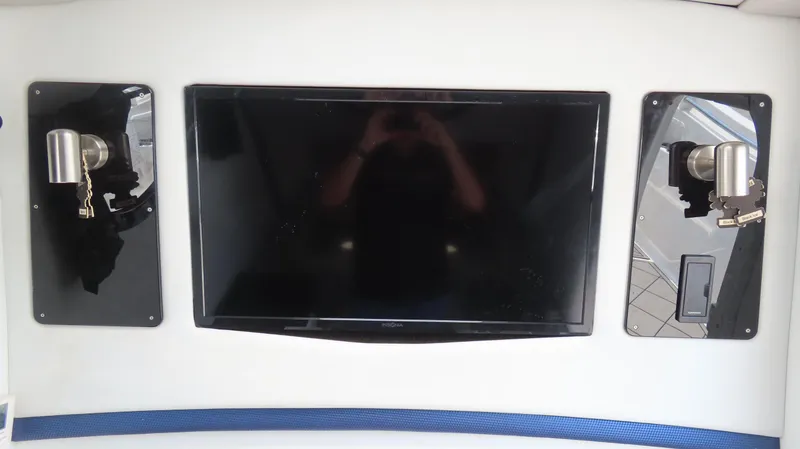 Slide: The Image of 2016 Sunsation 34 CCX interior with mounted TV and lighting fixtures. - 25