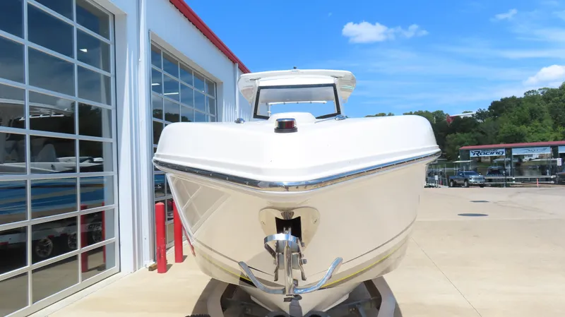 Slide: The Image of 2016 Sunsation 34 CCX boat front view at a marina under clear blue sky. - 3