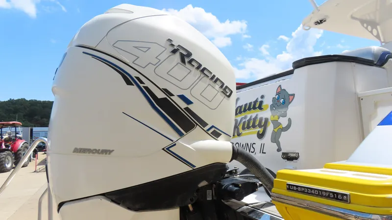 Slide: The Image of Mercury Racing 400 outboard engine on 2016 Sunsation 34 CCX boat, sunny day. - 6