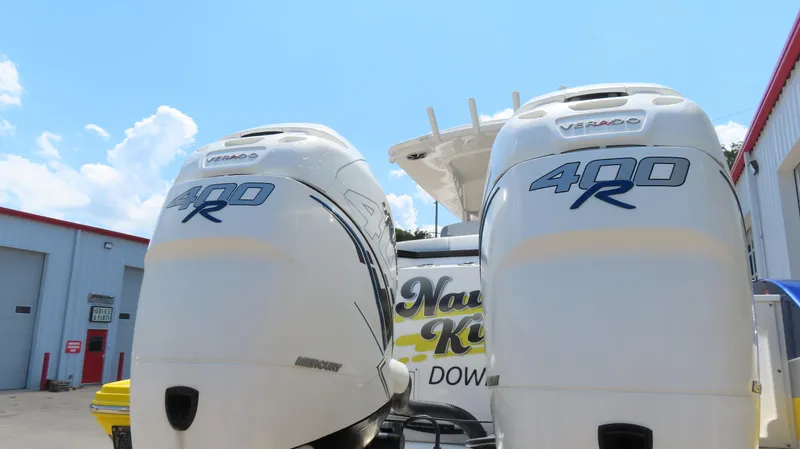 Slide: The Image of Twin Mercury 400R engines on a 2016 Sunsation 34 CCX boat at a service facility. - 8
