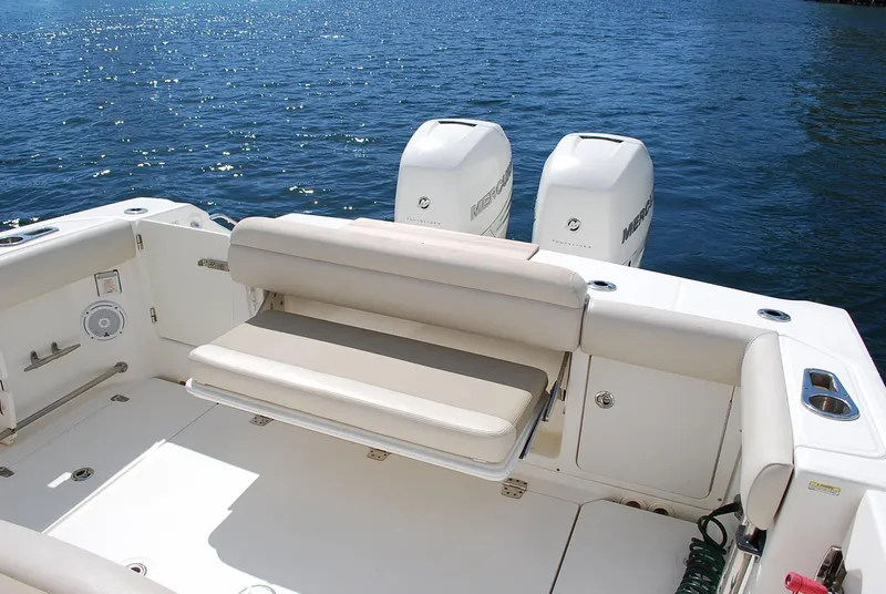 Slide: The Image of 2017 Boston Whaler 330 Outrage boat with dual Mercury engines on a sunny day. - 16