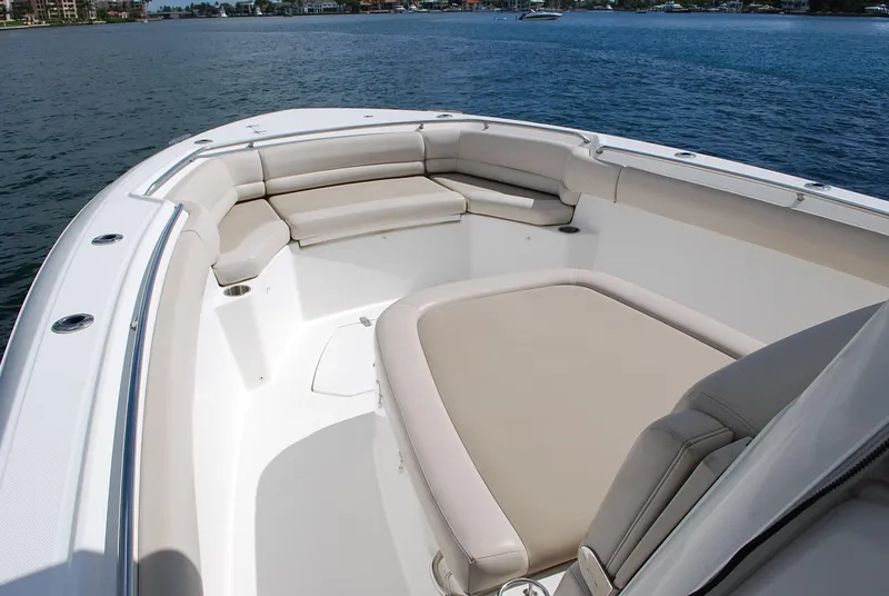 Slide: The Image of 2017 Boston Whaler 330 Outrage boat with spacious seating on calm water. - 18