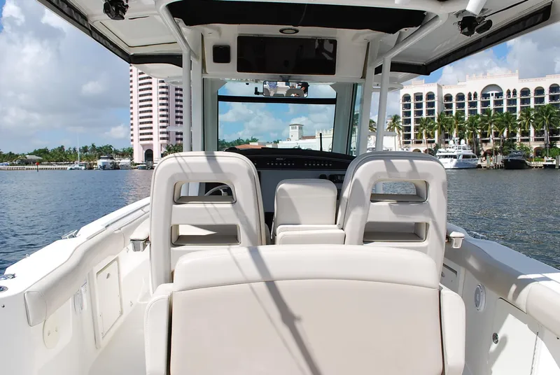 Slide: The Image of 2017 Boston Whaler 330 Outrage boat interior with waterfront view and luxury seating. - 21