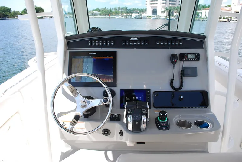 Slide: The Image of 2017 Boston Whaler 330 Outrage helm with advanced navigation and control systems. - 22