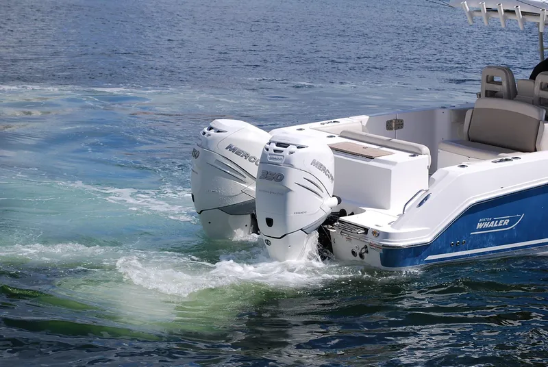 Slide: The Image of 2017 Boston Whaler 330 Outrage with dual Mercury engines on water. - 3