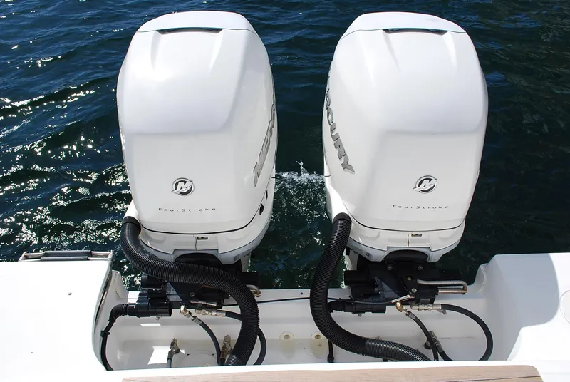 Slide: The Image of Twin Mercury outboard engines on a 2017 Boston Whaler 330 Outrage boat. - 6