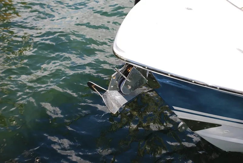 Slide: The Image of 2017 Boston Whaler 330 Outrage boat with anchor in water. - 8