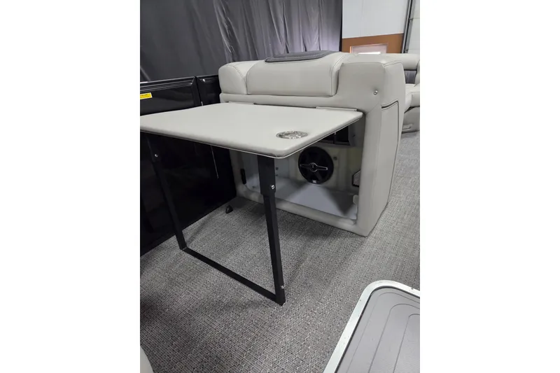 Slide: The Image of 2026 Barletta Lusso 25UC interior with foldable table and speaker, showcasing luxury design. - 11