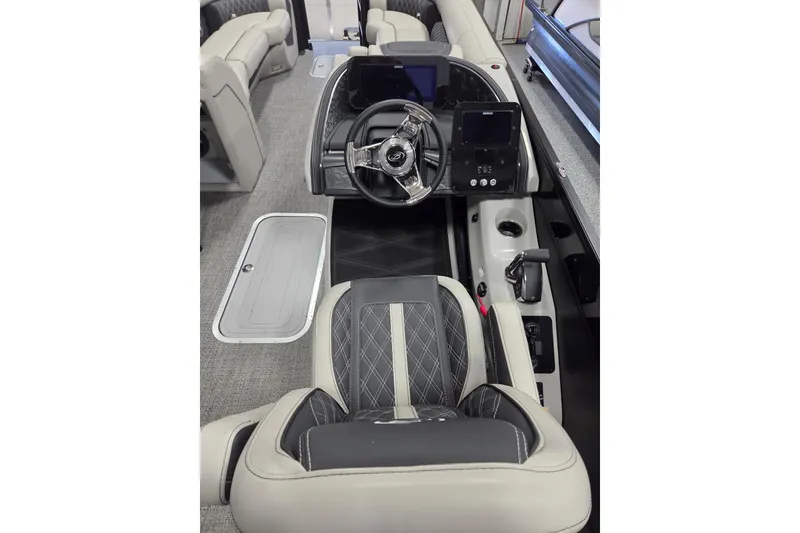 Slide: The Image of 2026 Barletta Lusso 25UC boat interior with modern steering console and luxurious seating. - 13