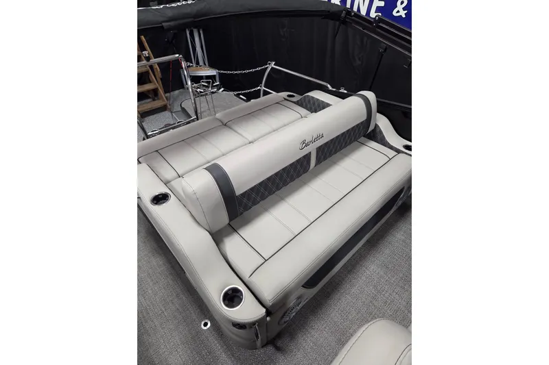 Slide: The Image of 2026 Barletta Lusso 25UC boat interior with luxurious seating and cup holders. - 15