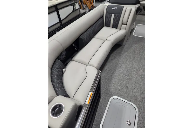 Slide: The Image of Luxurious seating on 2026 Barletta Lusso 25UC pontoon boat, featuring elegant upholstery and cup holder. - 8