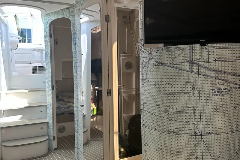 Slide: The Image of Interior of 2020 Intrepid 475 Sport Yacht with map decor and modern amenities. - 11