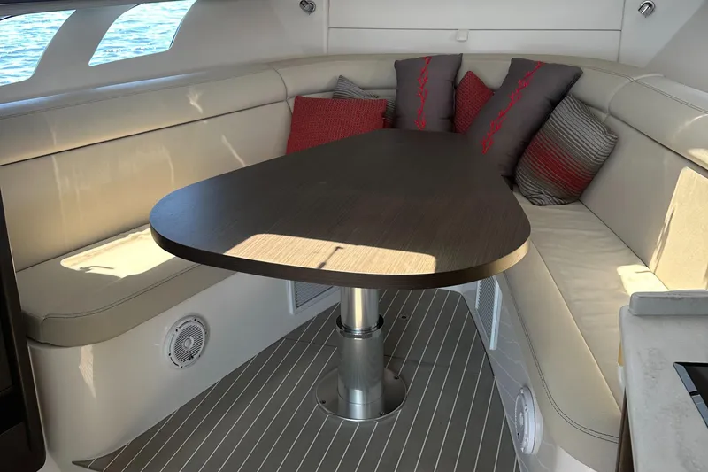 Slide: The Image of Luxurious interior of 2020 Intrepid 475 Sport Yacht with elegant seating and table. - 13