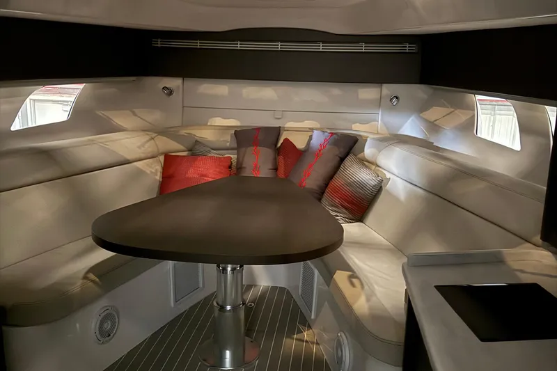 Slide: The Image of Luxurious interior of 2020 Intrepid 475 Sport Yacht with plush seating and elegant table. - 14