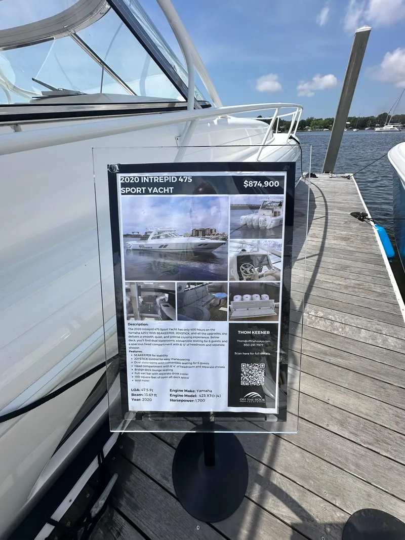Slide: The Image of 2020 Intrepid 475 Sport Yacht for sale, docked with price and details displayed. - 6
