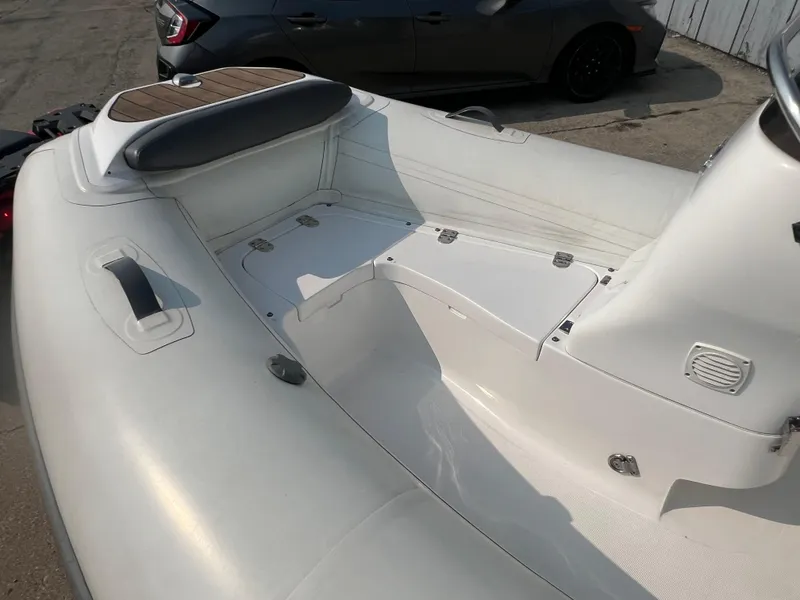 Slide: The Image of 2017 Walker Bay Generation 360 DLX inflatable boat interior with seating and storage compartments. - 9