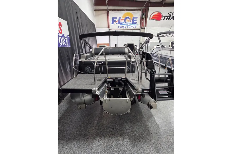 Slide: The Image of 2026 Barletta Corsa 23UC boat interior with sleek metal railings and modern seating. - 12