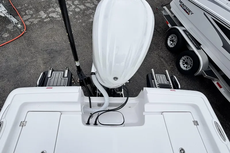 Slide: The Image of 2026 Tidewater 2300 Carolina Bay boat with outboard motor, viewed from above. - 11