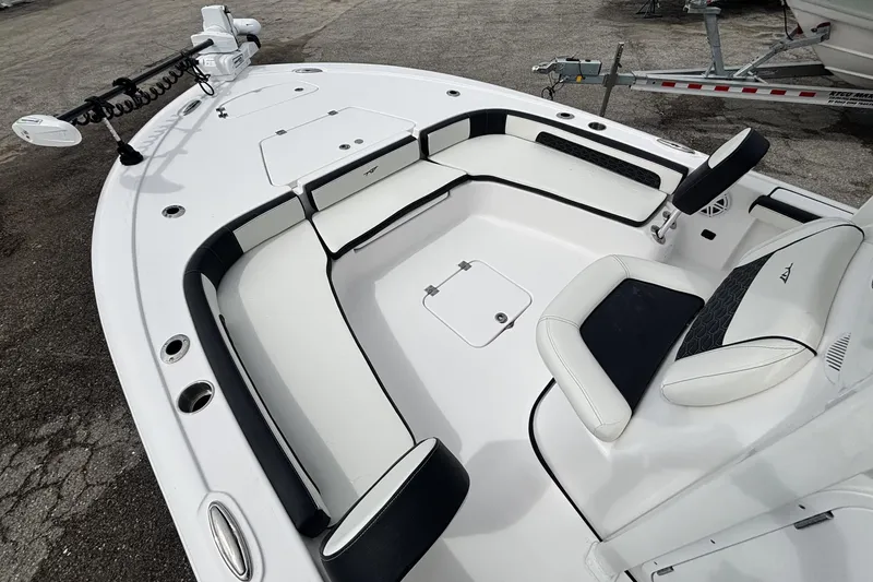 Slide: The Image of 2026 Tidewater 2300 Carolina Bay boat interior with cushioned seating and storage compartments. - 29