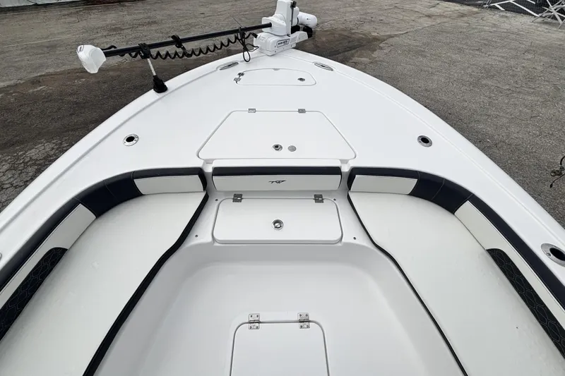 Slide: The Image of 2026 Tidewater 2300 Carolina Bay boat deck with storage compartments and seating. - 31