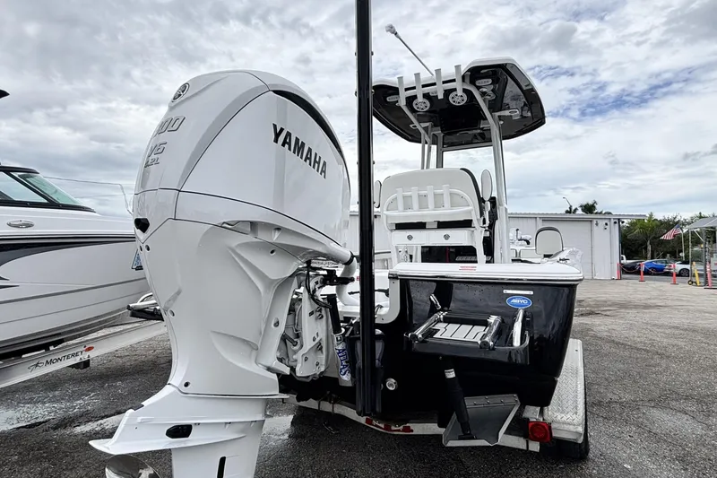 Slide: The Image of 2026 Tidewater 2300 Carolina Bay boat with Yamaha engine, parked outdoors. - 5