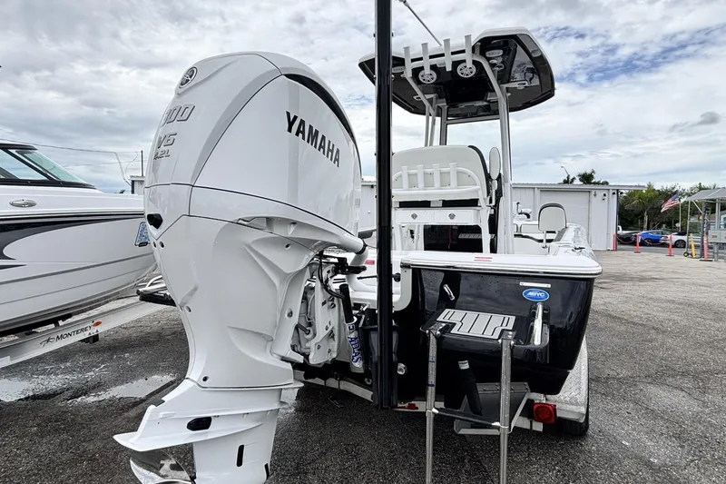 Slide: The Image of 2026 Tidewater 2300 Carolina Bay boat with Yamaha engine, parked outdoors. - 6