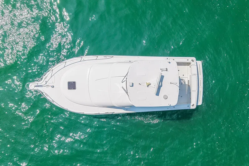 Slide: The Image of Aerial view of 2006 Tiara Yachts 3900 Convertible on turquoise water. - 11