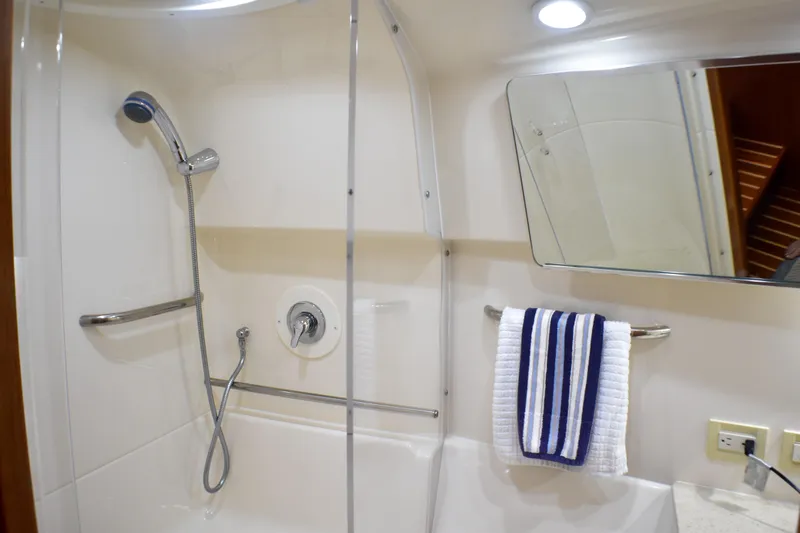 Slide: The Image of Bathroom interior of 2006 Tiara Yachts 3900 Convertible with shower and mirror. - 13