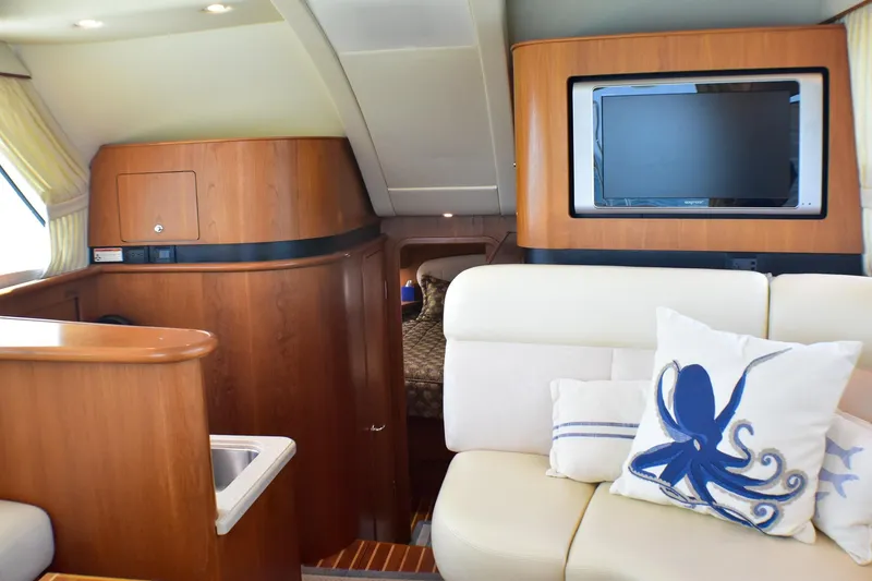 Slide: The Image of Interior of 2006 Tiara Yachts 3900 Convertible with TV and nautical decor. - 15