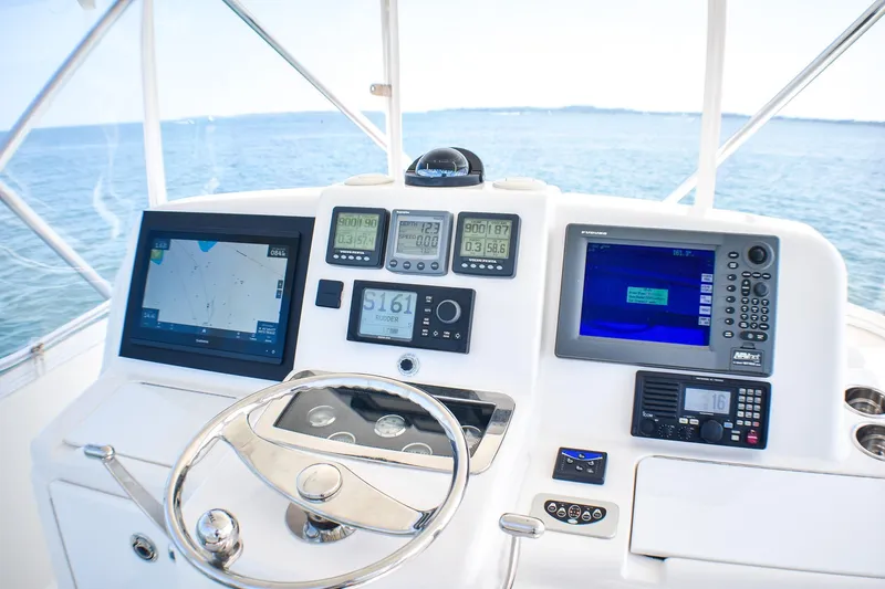 Slide: The Image of Helm of 2006 Tiara Yachts 3900 Convertible with navigation displays and controls. - 21