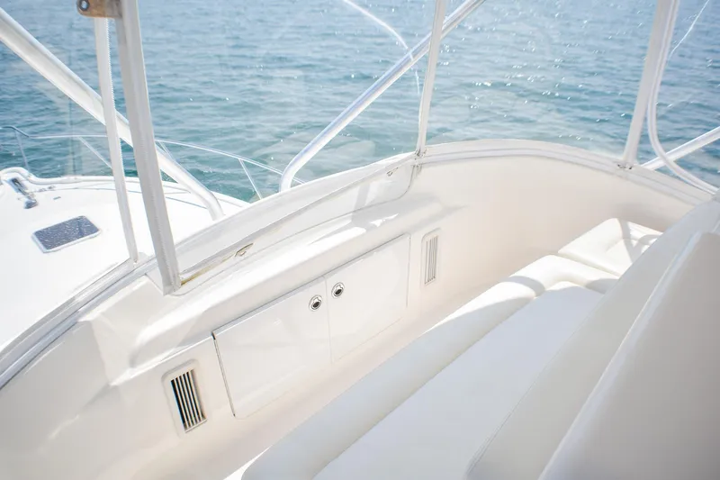 Slide: The Image of 2006 Tiara Yachts 3900 Convertible interior with white seating and ocean view. - 22