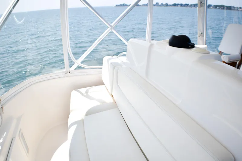 Slide: The Image of 2006 Tiara Yachts 3900 Convertible interior with ocean view and white seating. - 23