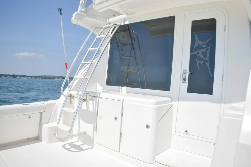 Slide: The Image of 2006 Tiara Yachts 3900 Convertible boat deck with ladder and ocean view. - 26