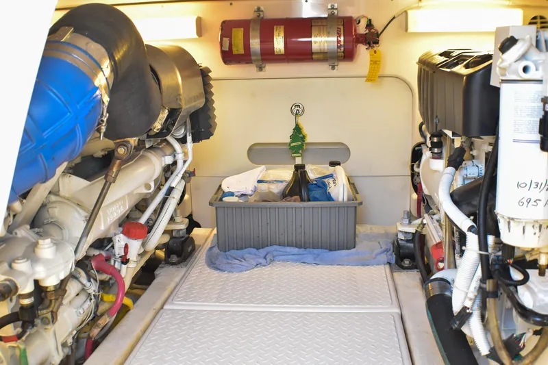 Slide: The Image of Engine room of 2006 Tiara Yachts 3900 Convertible with organized equipment and fire extinguisher. - 30