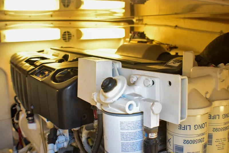 Slide: The Image of Engine room of 2006 Tiara Yachts 3900 Convertible, showcasing mechanical components and filters. - 31