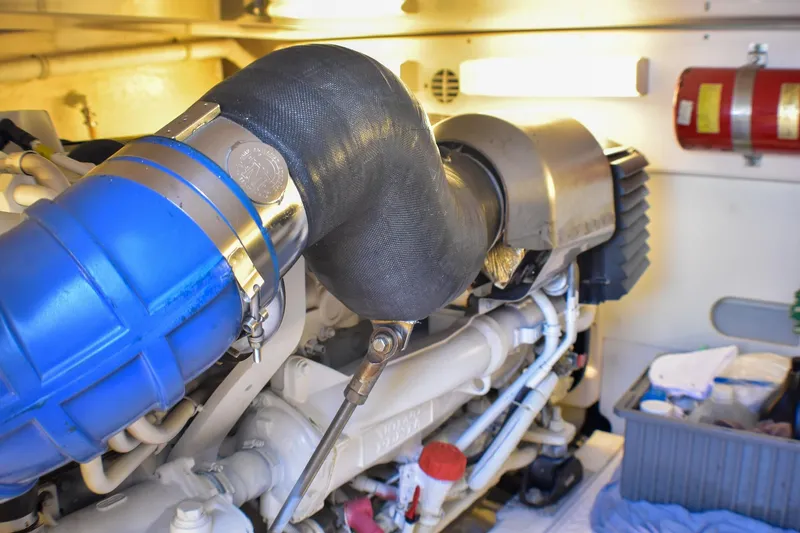 Slide: The Image of Engine room of 2006 Tiara Yachts 3900 Convertible with visible components and fire extinguisher. - 33