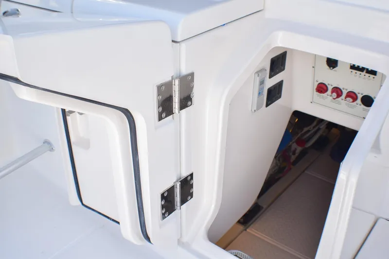 Slide: The Image of 2006 Tiara Yachts 3900 Convertible electrical panel and storage compartment. - 35