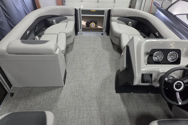 Slide: The Image of 2026 Barletta ARIA 20UC boat dashboard with steering wheel and Lowrance display. - 8