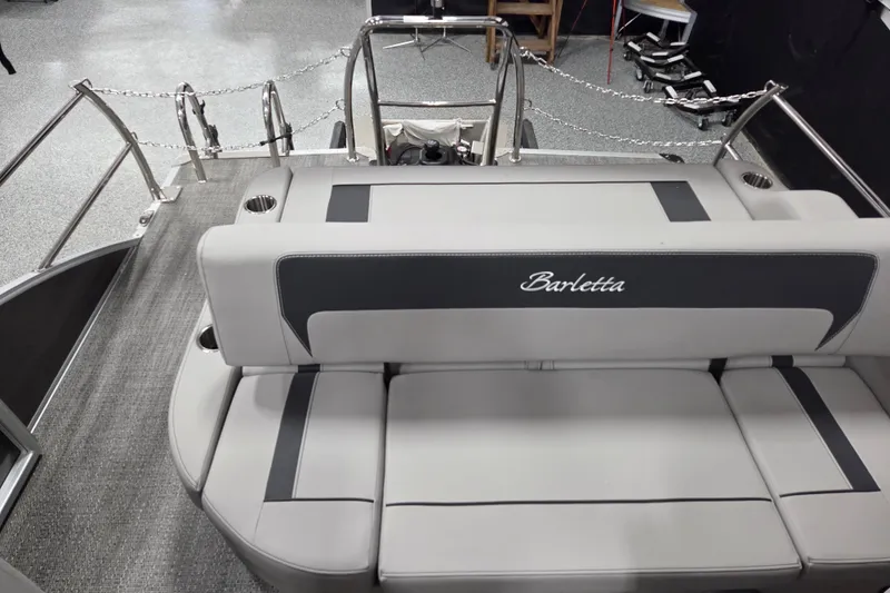 Slide: The Image of 2026 Barletta ARIA 20UC pontoon boat interior with plush seating and modern dashboard. - 9