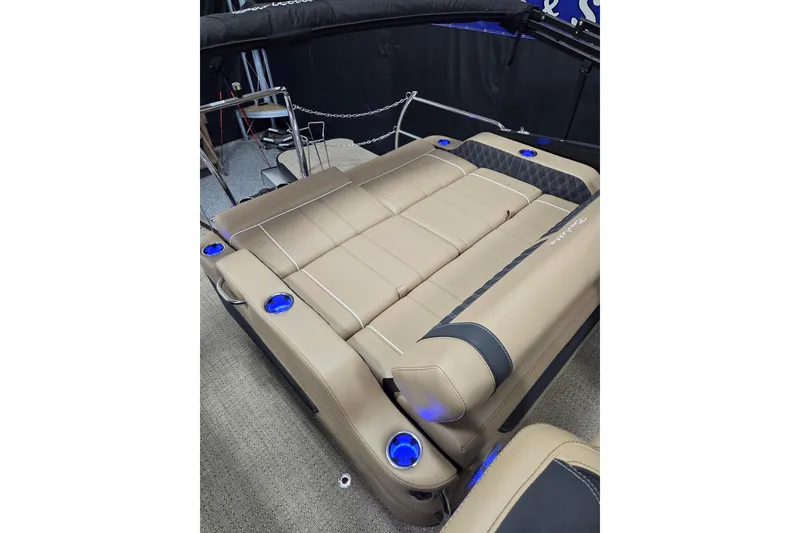Slide: The Image of Luxurious seating on 2026 Barletta Lusso 23UC pontoon boat with elegant design and blue lighting. - 12