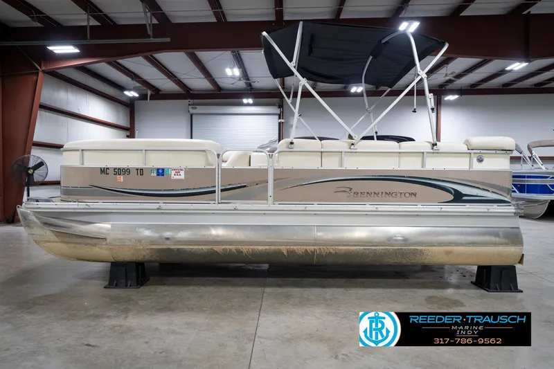 Slide: The Image of 2008 Bennington 20 SL pontoon boat in indoor storage facility. - 11